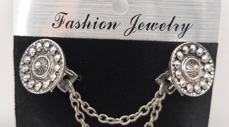 Clips met dubbel ketting Zeeuwse knoop in kleur antiek zilver look.
