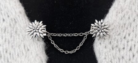 Clips met dubbel ketting, Edelweiss in zilverkleur.