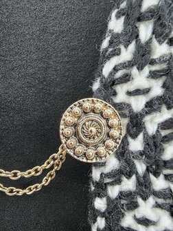 Clips met dubbel ketting Zeeuwse knoop goudkleurig.