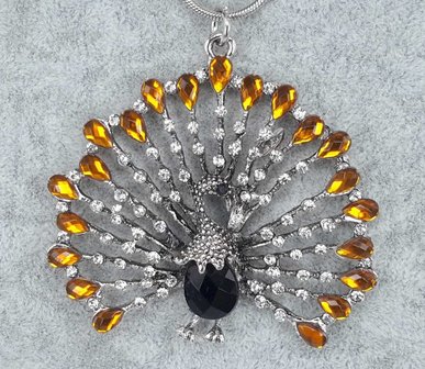 pomp&ouml;se Pfau, wei&szlig;er Strass, orange Strass tropfen