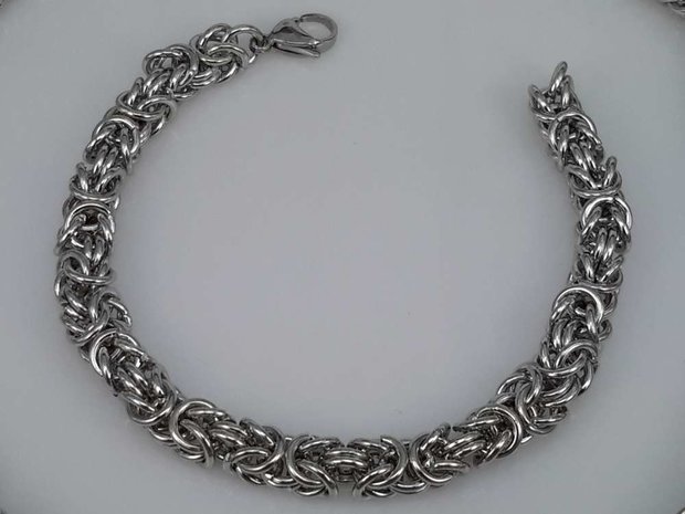 Edelstaal zilverkleurig Armband 22 cm, motief Draak rond dubbel schakel.