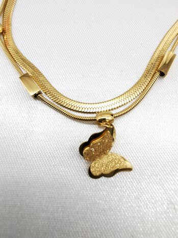 RVS Dubbele goudkleurig schakels armband met 1 vlinder.