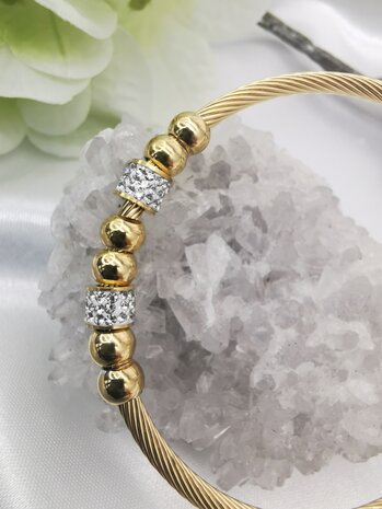 Flexibles Twisted-Armband aus Edelstahl in Goldfarbe mit Strasselementen