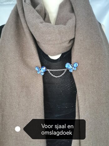 Clips met dubbel ketting, blauwe facet vlinder