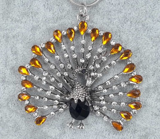 pompöse Pfau, weißer Strass, orange Strass tropfen