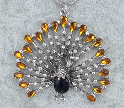 pompöse Pfau, weißer Strass, orange Strass tropfen